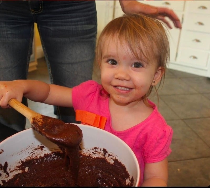 Riley baking as a little kid